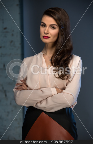 To use this stock image in your creative project, please select the size you need over to the right and click the "Add to Cart" button.
Your downloaded image will come with the Cutcaster watermark removed so don’t worry about the watermark you see on this page. Portrait glamorous brown-haired business style girl stock photo, Portrait glamorous brown-haired business style girl dressed in a blouse and a leather skirt by bezikus