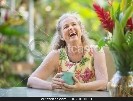 To use this stock image in your creative project, please select the size you need over to the right and click the "Add to Cart" button.
Your downloaded image will come with the Cutcaster watermark removed so don’t worry about the watermark you see on this page. Joyful Senior Woman Laughing stock photo, Joyful senior aged woman with mug laughing outdoors by Scott Griessel