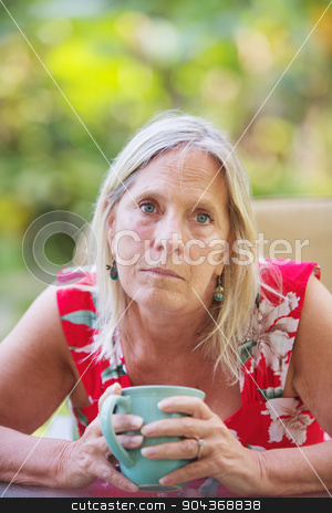 To use this stock image in your creative project, please select the size you need over to the right and click the "Add to Cart" button.
Your downloaded image will come with the Cutcaster watermark removed so don’t worry about the watermark you see on this page. Attractive Woman on Vacation stock photo, Sympathetic middle aged Caucasian female holding a coffee up by Scott Griessel