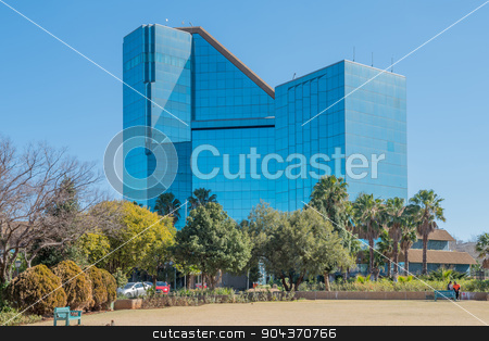 To use this stock image in your creative project, please select the size you need over to the right and click the "Add to Cart" button.
Your downloaded image will come with the Cutcaster watermark removed so don’t worry about the watermark you see on this page. Bram Fischer Building in Bloemfontein stock photo, BLOEMFONTEIN, SOUTH AFRICA - JULY 19, 2015: The Bram Fischer Building (local municipality building), also called the glass palace, was inaugurated in 1992 by Grobler du Preez
