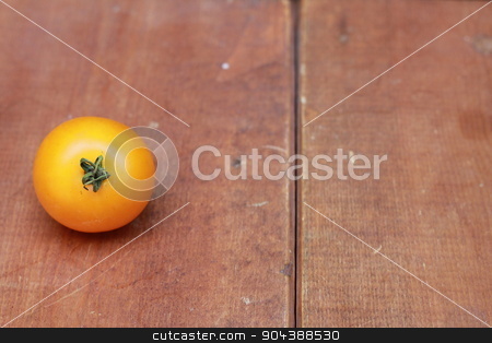 To use this stock image in your creative project, please select the size you need over to the right and click the "Add to Cart" button.
Your downloaded image will come with the Cutcaster watermark removed so don’t worry about the watermark you see on this page. Single yellow cherry tomato on wood background stock photo, Single yellow cherry tomato on wood background by Tara Huff