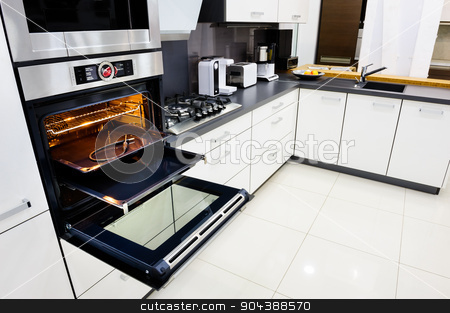 To use this stock image in your creative project, please select the size you need over to the right and click the "Add to Cart" button.
Your downloaded image will come with the Cutcaster watermark removed so don’t worry about the watermark you see on this page. Modern hi-tek kitchen, oven with open door stock photo, Modern luxury hi-tek black and white kitchen, clean interior design, focu at oven with open door by Serghei Starus