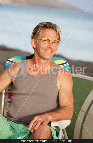 To use this stock image in your creative project, please select the size you need over to the right and click the "Add to Cart" button.
Your downloaded image will come with the Cutcaster watermark removed so don’t worry about the watermark you see on this page. Close up of Smiling Man at Beach stock photo, Close up of happy male sitting on beach by Scott Griessel