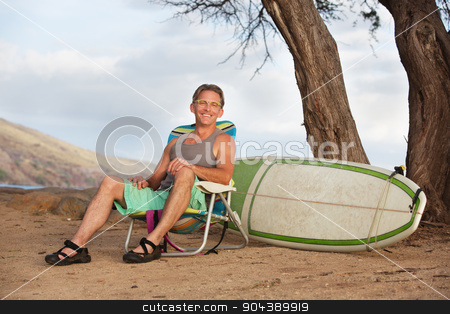 To use this stock image in your creative project, please select the size you need over to the right and click the "Add to Cart" button.
Your downloaded image will come with the Cutcaster watermark removed so don’t worry about the watermark you see on this page. Smiling Man Sitting with Surfboard stock photo, Single cheerful athletic male sitting with surfboard by Scott Griessel