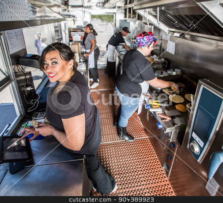 To use this stock image in your creative project, please select the size you need over to the right and click the "Add to Cart" button.
Your downloaded image will come with the Cutcaster watermark removed so don’t worry about the watermark you see on this page. Happy Cashier in Busy Food Truck stock photo, Happy cashier with payment on busy food truck by Scott Griessel