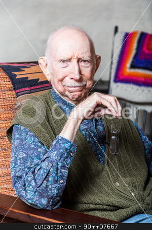 To use this stock image in your creative project, please select the size you need over to the right and click the "Add to Cart" button.
Your downloaded image will come with the Cutcaster watermark removed so don’t worry about the watermark you see on this page. Elder Gentleman in Livingroom stock photo, Stern elder gentleman sitting on chair in livingroom by Scott Griessel
