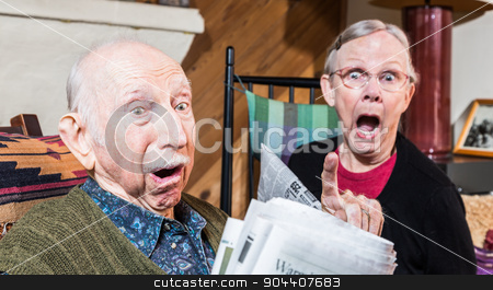 To use this stock image in your creative project, please select the size you need over to the right and click the "Add to Cart" button.
Your downloaded image will come with the Cutcaster watermark removed so don’t worry about the watermark you see on this page. Angry Old Couple with Newspaper stock photo, Angry older couple reading newspaper in living-room by Scott Griessel