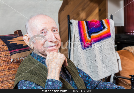 To use this stock image in your creative project, please select the size you need over to the right and click the "Add to Cart" button.
Your downloaded image will come with the Cutcaster watermark removed so don’t worry about the watermark you see on this page. Older Smiling Gentleman Sitting stock photo, Older gentleman smiling and seated in his living-room by Scott Griessel