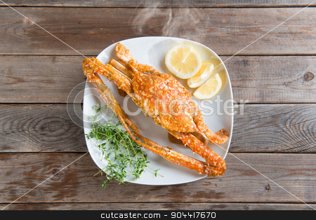 To use this stock image in your creative project, please select the size you need over to the right and click the "Add to Cart" button.
Your downloaded image will come with the Cutcaster watermark removed so don’t worry about the watermark you see on this page. Hot and spicy sauce blue crab stock photo, Top view cooked delicious hot and spicy sauce blue crab on white plate, at wood background. Fresh cook with hot smoke steams. by szefei