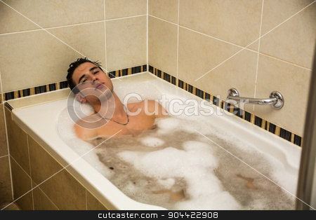 Handsome Young Man In Bathtub At Home Having Bath Stock Photo