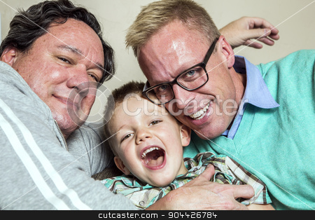 To use this stock image in your creative project, please select the size you need over to the right and click the "Add to Cart" button.
Your downloaded image will come with the Cutcaster watermark removed so don’t worry about the watermark you see on this page. Gay Couple with Young Son stock photo, Two gay men hug their happy young son by Scott Griessel