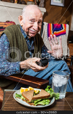 To use this stock image in your creative project, please select the size you need over to the right and click the "Add to Cart" button.
Your downloaded image will come with the Cutcaster watermark removed so don’t worry about the watermark you see on this page. Elderly Man with Sandwich stock photo, Elderly man alone in green vest with sandwich by Scott Griessel
