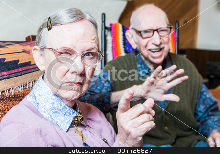 To use this stock image in your creative project, please select the size you need over to the right and click the "Add to Cart" button.
Your downloaded image will come with the Cutcaster watermark removed so don’t worry about the watermark you see on this page. Angry Old Couple in Livingroom stock photo, Angry old couple sitting in living room woman pointing by Scott Griessel