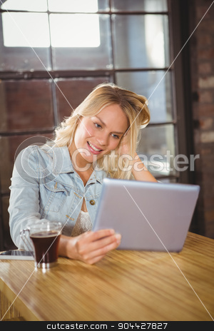 To use this stock image in your creative project, please select the size you need over to the right and click the "Add to Cart" button.
Your downloaded image will come with the Cutcaster watermark removed so don’t worry about the watermark you see on this page. Smiling blonde holding tablet computer stock photo, Smiling blonde holding tablet computer at coffee shop by Wavebreak Media