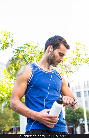 To use this stock image in your creative project, please select the size you need over to the right and click the "Add to Cart" button.
Your downloaded image will come with the Cutcaster watermark removed so don’t worry about the watermark you see on this page. Handsome athlete with bottle checking heart rate watch stock photo, Handsome athlete with bottle checking heart rate watch in the city by Wavebreak Media