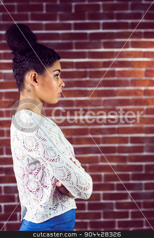 To use this stock image in your creative project, please select the size you need over to the right and click the "Add to Cart" button.
Your downloaded image will come with the Cutcaster watermark removed so don’t worry about the watermark you see on this page. Close up of a serious woman looking away stock photo, Close up of a serious woman looking away on a brick wall by Wavebreak Media