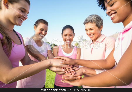 To use this stock image in your creative project, please select the size you need over to the right and click the "Add to Cart" button.
Your downloaded image will come with the Cutcaster watermark removed so don’t worry about the watermark you see on this page. Women wearing pink for breast cancer and putting hands together stock photo, Women wearing pink for breast cancer and putting hands together in parkland by Wavebreak Media