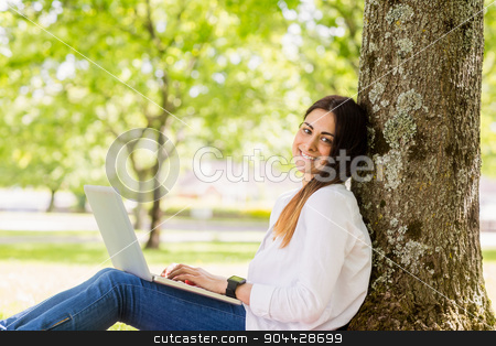 To use this stock image in your creative project, please select the size you need over to the right and click the "Add to Cart" button.
Your downloaded image will come with the Cutcaster watermark removed so don’t worry about the watermark you see on this page. Beautiful brunette using laptop in the park stock photo, Beautiful brunette using laptop in the park on a sunny day by Wavebreak Media