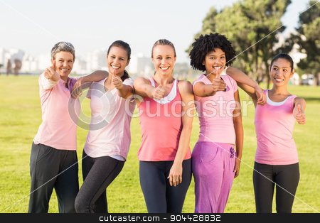 To use this stock image in your creative project, please select the size you need over to the right and click the "Add to Cart" button.
Your downloaded image will come with the Cutcaster watermark removed so don’t worry about the watermark you see on this page. Smiling women wearing pink for breast cancer and doing thumbs up stock photo, Portrait of smiling women wearing pink for breast cancer and doing thumbs up in parkland by Wavebreak Media