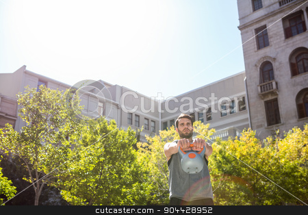 To use this stock image in your creative project, please select the size you need over to the right and click the "Add to Cart" button.
Your downloaded image will come with the Cutcaster watermark removed so don’t worry about the watermark you see on this page. Handsome athlete lifting kettle bell stock photo, Handsome athlete lifting kettle bell in the city by Wavebreak Media