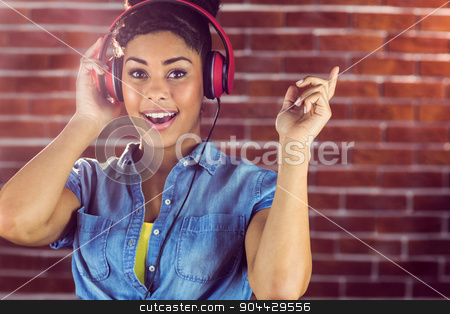 To use this stock image in your creative project, please select the size you need over to the right and click the "Add to Cart" button.
Your downloaded image will come with the Cutcaster watermark removed so don’t worry about the watermark you see on this page. Portrait of young woman smiling at her song stock photo, Portrait of young woman smiling at her song on a red brick wall by Wavebreak Media