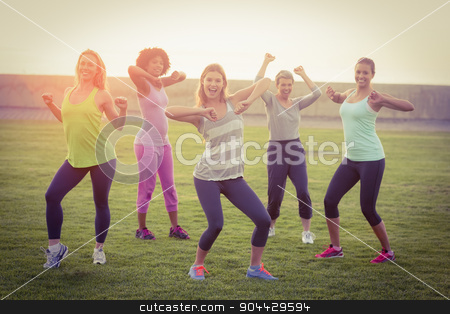 To use this stock image in your creative project, please select the size you need over to the right and click the "Add to Cart" button.
Your downloaded image will come with the Cutcaster watermark removed so don’t worry about the watermark you see on this page. Happy sporty women dancing during fitness class stock photo, Portrait of happy sporty women dancing during fitness class in parkland by Wavebreak Media