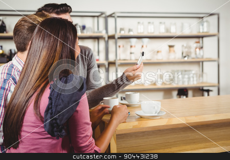 To use this stock image in your creative project, please select the size you need over to the right and click the "Add to Cart" button.
Your downloaded image will come with the Cutcaster watermark removed so don’t worry about the watermark you see on this page. Group of friends looking at a smartphone stock photo, Group of friends looking at a smartphone in a cafe by Wavebreak Media