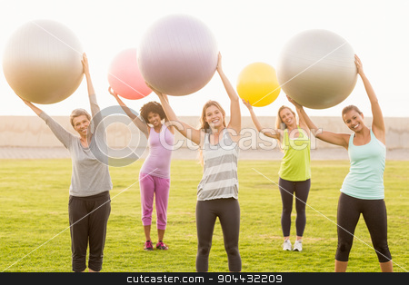 To use this stock image in your creative project, please select the size you need over to the right and click the "Add to Cart" button.
Your downloaded image will come with the Cutcaster watermark removed so don’t worry about the watermark you see on this page. Smiling sporty women working out with exercise balls stock photo, Portrait of smiling sporty women working out with exercise balls in parkland by Wavebreak Media