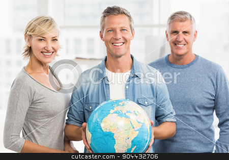 To use this stock image in your creative project, please select the size you need over to the right and click the "Add to Cart" button.
Your downloaded image will come with the Cutcaster watermark removed so don’t worry about the watermark you see on this page. Smiling businessman holding terrestrial globe stock photo, Portrait of a smiling businessman holding terrestrial globe at office by Wavebreak Media