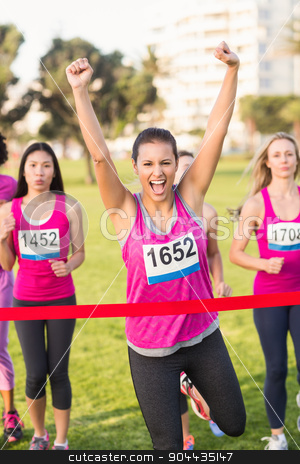 To use this stock image in your creative project, please select the size you need over to the right and click the "Add to Cart" button.
Your downloaded image will come with the Cutcaster watermark removed so don’t worry about the watermark you see on this page. Cheering brunette winning breast cancer marathon stock photo, Portrait of cheering brunette winning breast cancer marathon in parkland by Wavebreak Media