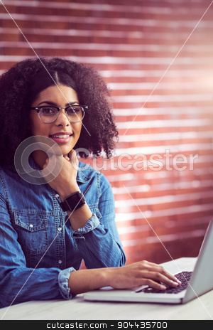 To use this stock image in your creative project, please select the size you need over to the right and click the "Add to Cart" button.
Your downloaded image will come with the Cutcaster watermark removed so don’t worry about the watermark you see on this page. Casual businesswoman using laptop and smartwatch stock photo, Casual businesswoman using laptop and smartwatch in her office by Wavebreak Media