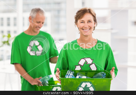 To use this stock image in your creative project, please select the size you need over to the right and click the "Add to Cart" button.
Your downloaded image will come with the Cutcaster watermark removed so don’t worry about the watermark you see on this page. Smiling eco-minded woman holding recycling box stock photo, Portrait of smiling eco-minded woman holding recycling box in the office by Wavebreak Media