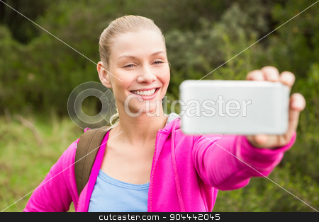To use this stock image in your creative project, please select the size you need over to the right and click the "Add to Cart" button.
Your downloaded image will come with the Cutcaster watermark removed so don’t worry about the watermark you see on this page. Smiling female hiker taking a selfie stock photo, Smiling female hiker taking a selfie in the nature by Wavebreak Media