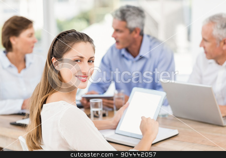 To use this stock image in your creative project, please select the size you need over to the right and click the "Add to Cart" button.
Your downloaded image will come with the Cutcaster watermark removed so don’t worry about the watermark you see on this page. Smiling businesswoman with tablet in a meeting stock photo, Portrait of smiling businesswoman with tablet in a meeting in the office by Wavebreak Media