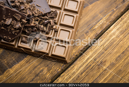 To use this stock image in your creative project, please select the size you need over to the right and click the "Add to Cart" button.
Your downloaded image will come with the Cutcaster watermark removed so don’t worry about the watermark you see on this page. Dark and milk chocolate on a wooden table stock photo, Close up view of dark and milk chocolate on a wooden table by Wavebreak Media