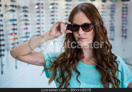 To use this stock image in your creative project, please select the size you need over to the right and click the "Add to Cart" button.
Your downloaded image will come with the Cutcaster watermark removed so don’t worry about the watermark you see on this page. Pretty woman shopping for sunglasses stock photo, Pretty woman shopping for sunglasses at the optometry store by Wavebreak Media