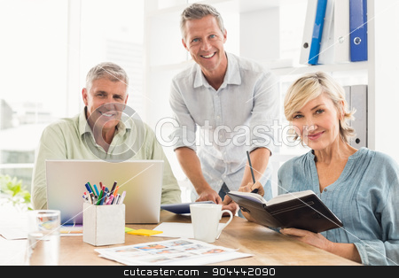 To use this stock image in your creative project, please select the size you need over to the right and click the "Add to Cart" button.
Your downloaded image will come with the Cutcaster watermark removed so don’t worry about the watermark you see on this page. Smiling business team looking at the camera stock photo, Portrait of a smiling business team working together at office by Wavebreak Media
