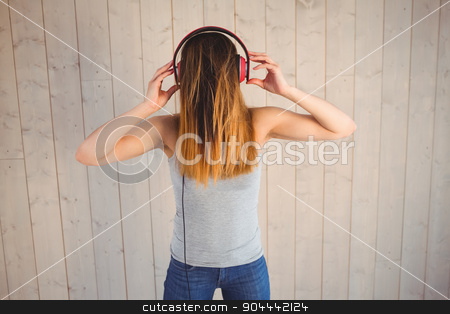 To use this stock image in your creative project, please select the size you need over to the right and click the "Add to Cart" button.
Your downloaded image will come with the Cutcaster watermark removed so don’t worry about the watermark you see on this page. Pretty hipster listening to music stock photo, Pretty hipster listening to music on wooden planks background by Wavebreak Media