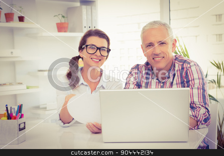 To use this stock image in your creative project, please select the size you need over to the right and click the "Add to Cart" button.
Your downloaded image will come with the Cutcaster watermark removed so don’t worry about the watermark you see on this page. Smiling casual designers looking at camera stock photo, Portrait of smiling casual designers looking at camera in the office by Wavebreak Media