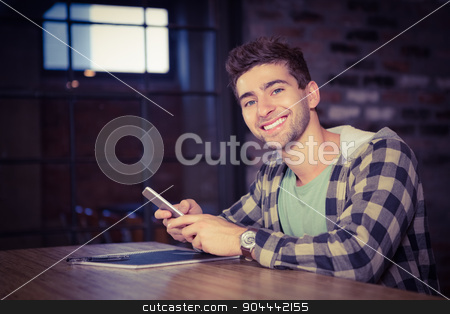 To use this stock image in your creative project, please select the size you need over to the right and click the "Add to Cart" button.
Your downloaded image will come with the Cutcaster watermark removed so don’t worry about the watermark you see on this page. Smiling hipster using smartphone stock photo, Portrait of smiling hipster using smartphone at coffee shop by Wavebreak Media