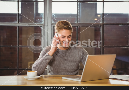 To use this stock image in your creative project, please select the size you need over to the right and click the "Add to Cart" button.
Your downloaded image will come with the Cutcaster watermark removed so don’t worry about the watermark you see on this page. Handsome man smiling and phoning with smartphone stock photo, Handsome man smiling and phoning with smartphone at coffee shop by Wavebreak Media