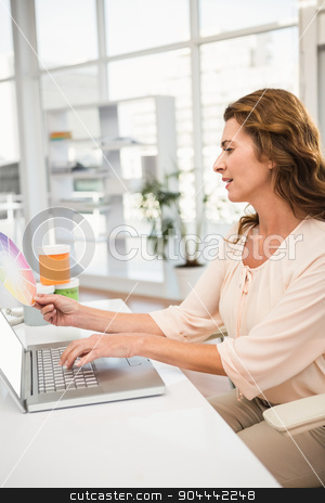 To use this stock image in your creative project, please select the size you need over to the right and click the "Add to Cart" button.
Your downloaded image will come with the Cutcaster watermark removed so don’t worry about the watermark you see on this page. Casual designer working with laptop and colour chart stock photo, Casual designer working with laptop and colour chart in the office by Wavebreak Media