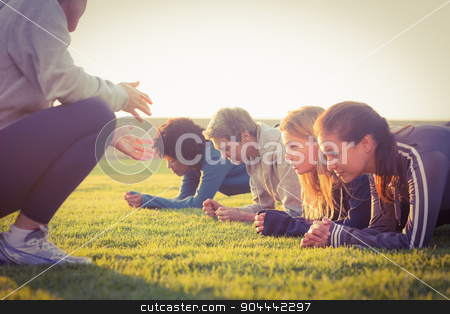 To use this stock image in your creative project, please select the size you need over to the right and click the "Add to Cart" button.
Your downloaded image will come with the Cutcaster watermark removed so don’t worry about the watermark you see on this page. Sporty women planking during fitness class stock photo, Sporty women planking during fitness class in parkland by Wavebreak Media