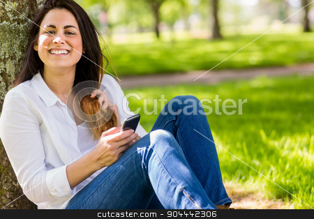 To use this stock image in your creative project, please select the size you need over to the right and click the "Add to Cart" button.
Your downloaded image will come with the Cutcaster watermark removed so don’t worry about the watermark you see on this page. Beautiful brunette sending text in the park stock photo, Beautiful brunette sending text in the park on a sunny day by Wavebreak Media