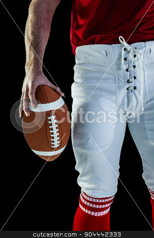 To use this stock image in your creative project, please select the size you need over to the right and click the "Add to Cart" button.
Your downloaded image will come with the Cutcaster watermark removed so don’t worry about the watermark you see on this page. American football player holding football stock photo, American football player holding football against black background by Wavebreak Media