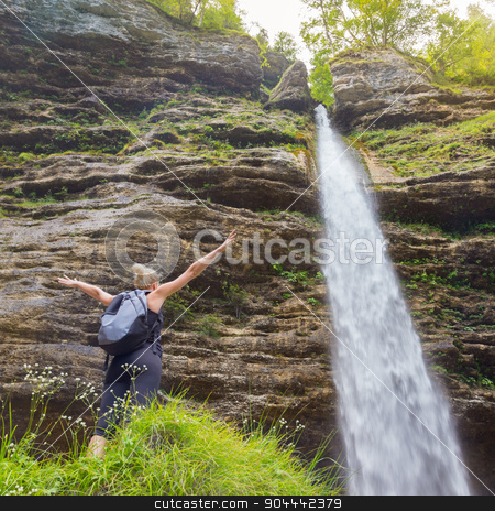 To use this stock image in your creative project, please select the size you need over to the right and click the "Add to Cart" button.
Your downloaded image will come with the Cutcaster watermark removed so don’t worry about the watermark you see on this page. Active sporty woman relaxing in beautiful nature. stock photo, Female hiker raising arms inhaling fresh air, feeling relaxed and free in beautiful natural environment under Pericnik waterfall in Vrata Valley in Triglav National Park in Julian Alps, Slovenia. by kasto