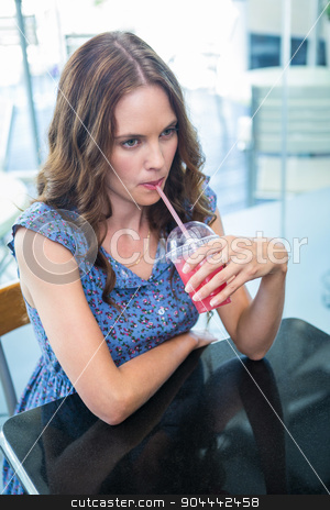 To use this stock image in your creative project, please select the size you need over to the right and click the "Add to Cart" button.
Your downloaded image will come with the Cutcaster watermark removed so don’t worry about the watermark you see on this page. Pretty brunette sipping on a smoothie stock photo, Pretty brunette sipping on a smoothie in a coffee shop by Wavebreak Media