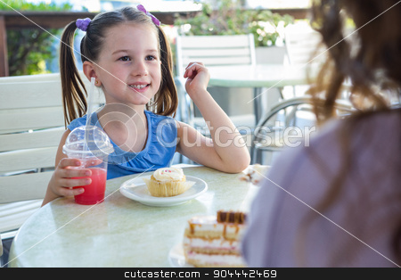 To use this stock image in your creative project, please select the size you need over to the right and click the "Add to Cart" button.
Your downloaded image will come with the Cutcaster watermark removed so don’t worry about the watermark you see on this page. Mother and daughter enjoying cakes at cafe terrace stock photo, Mother and daughter enjoying cakes at cafe terrace on a sunny day by Wavebreak Media