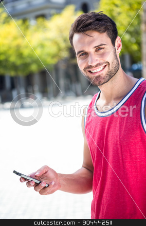 To use this stock image in your creative project, please select the size you need over to the right and click the "Add to Cart" button.
Your downloaded image will come with the Cutcaster watermark removed so don’t worry about the watermark you see on this page. Smiling handsome athlete sending a text stock photo, Portrait of a smiling athlete sending a text on a sunny day by Wavebreak Media