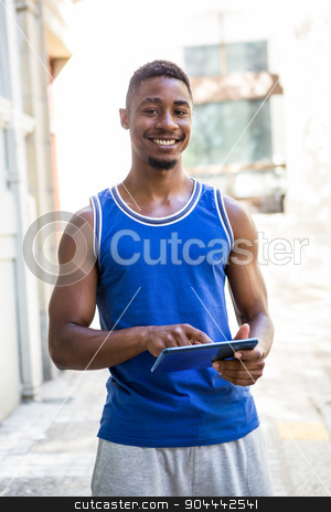 To use this stock image in your creative project, please select the size you need over to the right and click the "Add to Cart" button.
Your downloaded image will come with the Cutcaster watermark removed so don’t worry about the watermark you see on this page. Smiling athletic man using tablet computer stock photo, Smiling athletic man using tablet computer in the city by Wavebreak Media
